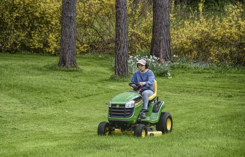 using an powered mower safely with ear protection