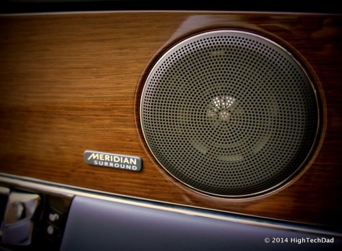 a speaker driver cavity in the frame of a car