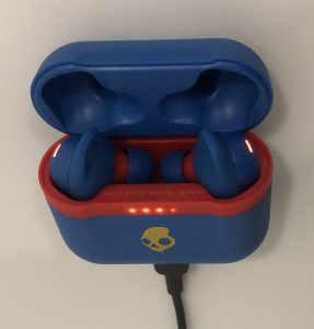 Skullcandy Indy Evo earbuds in case charging up
