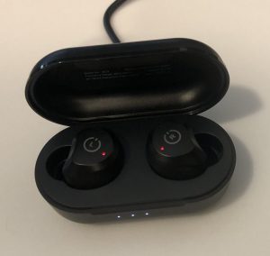 TOZO NC9 earbuds and case plugged in and charging