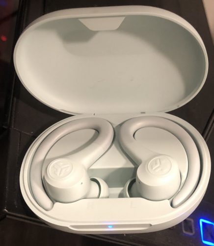 Jlab GO Air Sport earbuds and case plugged in and charging up