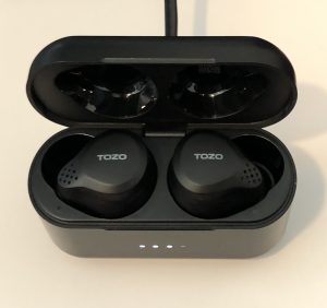 TOZO NC7 2022 earbuds and case plugged in and charging up
