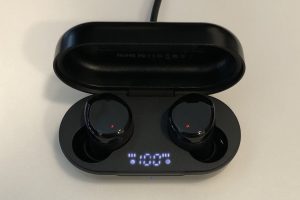 TOZO T12 2022 wireless earbuds and case plugged in and charging up