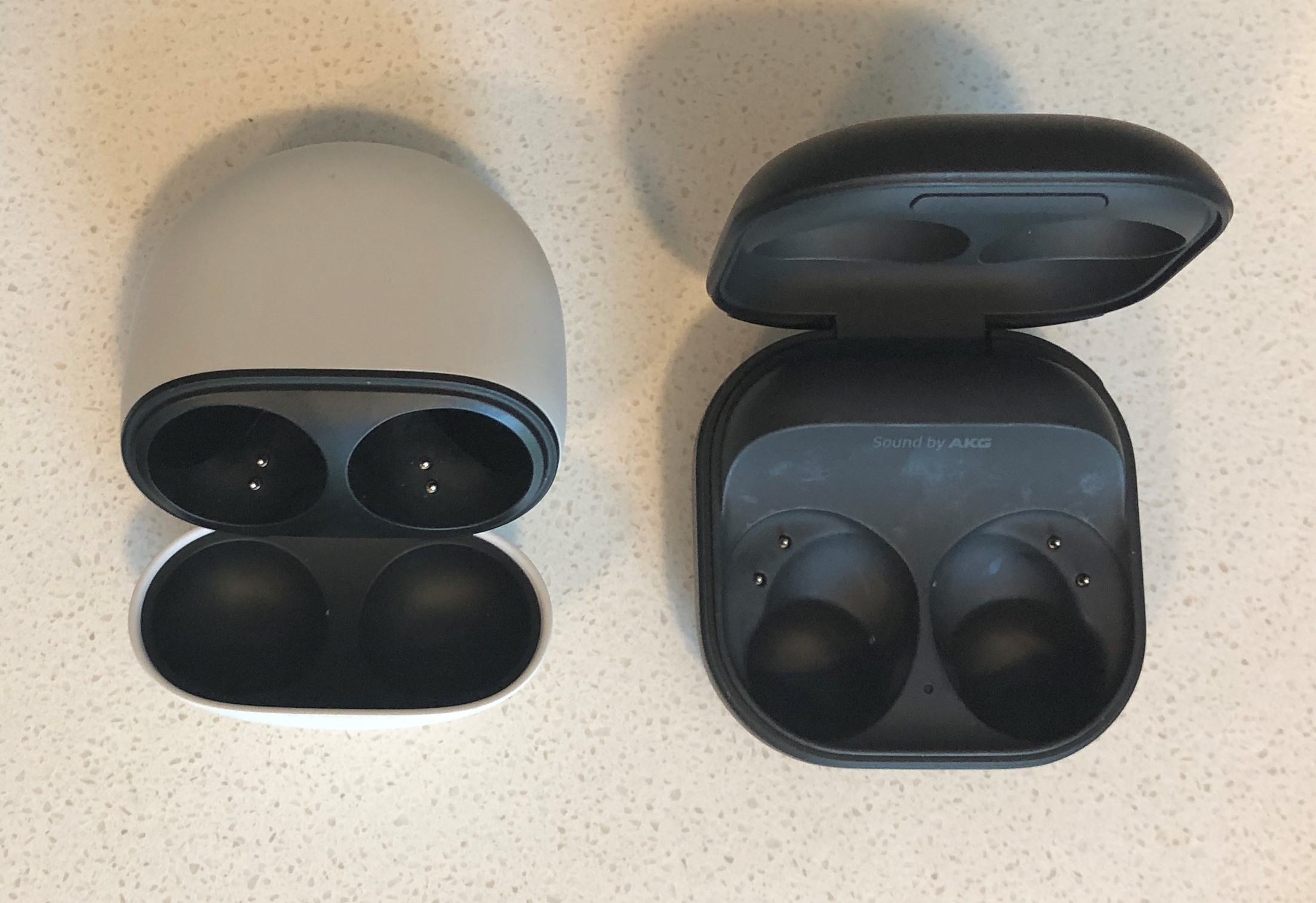 Google Pixel Buds Pro vs Samsung Galaxy Buds2 Pro charging and carrying case opened inside