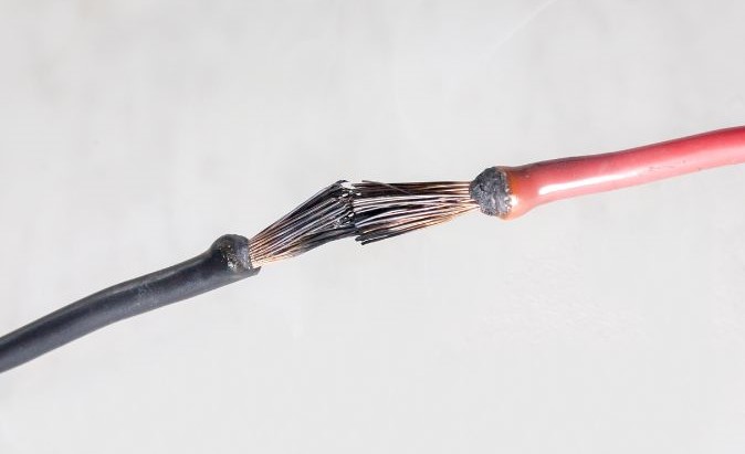 touching speaker wire short circuit